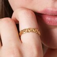 Close up of Gold Stainless Steel Braided Band Ring on model