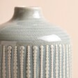 Close up of Large Ceramic Indented Flower Vase against beige coloured backdrop