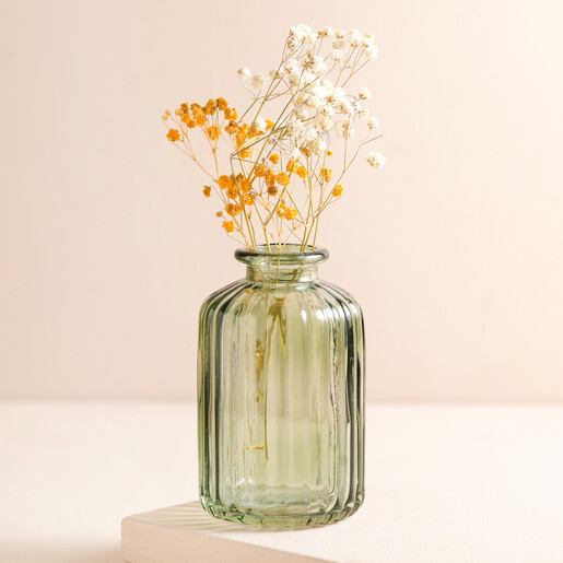 Green Glass Ribbed Bottle Vase with orange and white posy