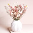 Peachy Haze Dried Flower Bouquet arranged inside of a white vase