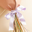 Close up of bow on Luxury Rainbow Brights Dried Flower Bouquet
