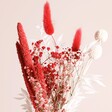 Close up of flowers in Red and White Valentine's Dried Flower Posy against neutral background