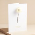 Personalised Single Stem White Greetings Card stood against beige coloured backdrop