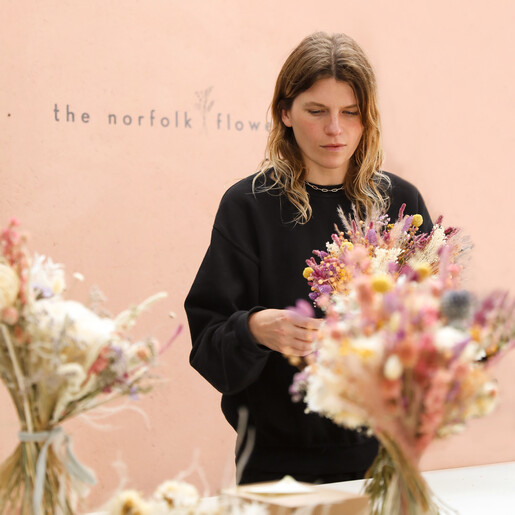 Model arranging wedding flowers in Nancy Dried Flower Bridal Wedding Bouquet