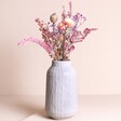 Summer Loving Dried Flower Posy arranged in vase against beige background