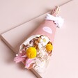 Summer Sunshine Dried Flower Posy in packaging on top of beige background