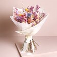 Betty Dried Flower Bridal Wedding Bouquet in paper standing on top of neutral backdrop