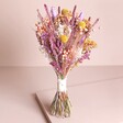 Betty Dried Flower Bridesmaid Wedding Posy standing against neutral backdrop