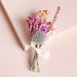 Betty Dried Flower Wedding Buttonhole on top of neutral coloured backdrop