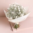 Dorothy Dried Flower Bridal Wedding Bouquet wrapped in white paper against neutral backdrop