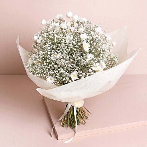 Dorothy Dried Flower Bridal Wedding Bouquet Dorothy Dried Flower Bridal Wedding Bouquet wrapped in white paper against neutral backdrop