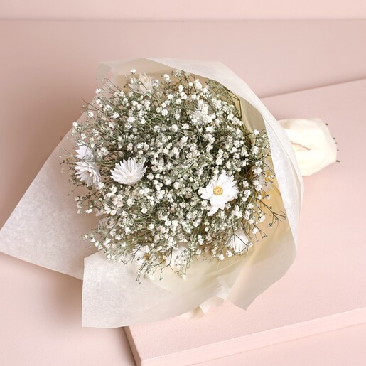 Dorothy Dried Flower Bridesmaid Wedding Posy laid out on beige backdrop wrapped in paper