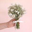 Model holding Dorothy Dried Flower Bridesmaid Wedding Posy in front of neutral coloured backdrop