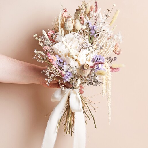 Model Holding Bouquet Model holding Margot Dried Flower Bridal Wedding Bouquet against neutral background