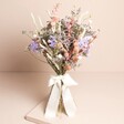 Margot Dried Flower Bridesmaid Wedding Posy standing against beige coloured backdrop