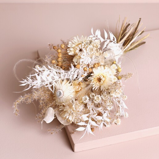 Nancy Dried Flower Bridesmaid Wedding Posy laid on top of beige backdrop