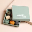 Hana Blossom Mood Pebble Soaps in Box on Pink Surface