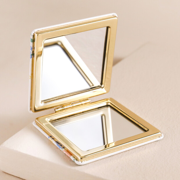 Open Enjoy the Little Things Compact Mirror on Pink Surface