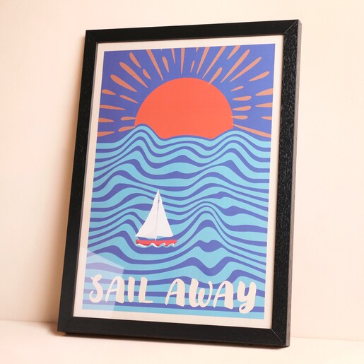 Wall Chart Sail Away Print A3 Framed Against Beige Surface