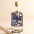 Personalised 500ml Name Celestial Gin. It reads 'Amelie's gin' in cursive font. There is a blue label on the back with celestial patterning.