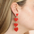 My Doris Red Beaded Heart Drop Earrings on model