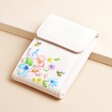 Bee Floral Manicure Set leaning against a beige raised surface