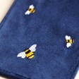 Close up of embroidered bees on Navy Velvet Bee Glasses Case