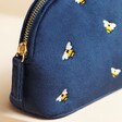 Close up of zip on Small Navy Velvet Bee Wash Bag