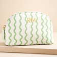 Personalised Small Green Wavy Lines Wash Bag against beige coloured background