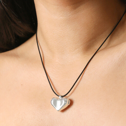 Close up of Chunky Heart Locket Cord Necklace in Silver on  model