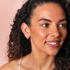 Model Wearing Curved Wrap Huggie Hoop Earrings in Silver