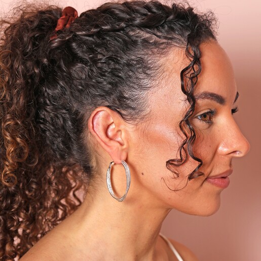 Triple Layered Thread Hoop Earrings in Silver on model against pink coloured background