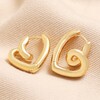 Large Scribble Heart Hoop Earrings in Gold on Beige Fabric