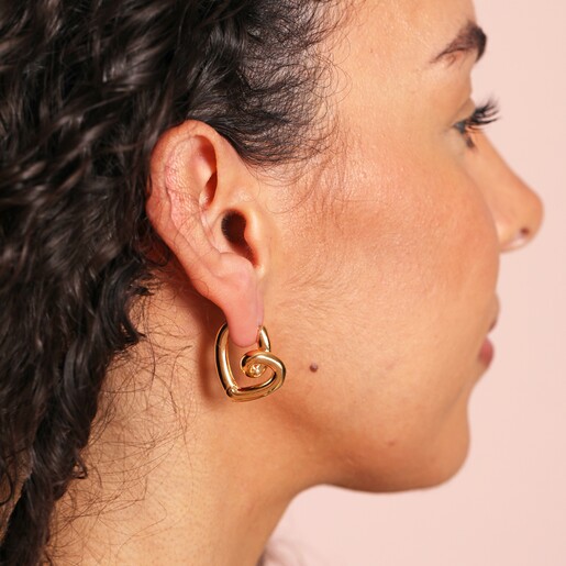 Model Wearing Large Scribble Heart Hoop Earrings in Gold
