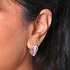 Close up of Molten Heart Half Hoop Earrings in Silver on model