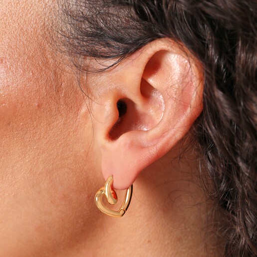 Close up of Small Scribble Heart Hoop Earrings in Gold on model
