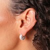 Close Up of Small Chunky Half Hoop Earrings in Silver on Model 