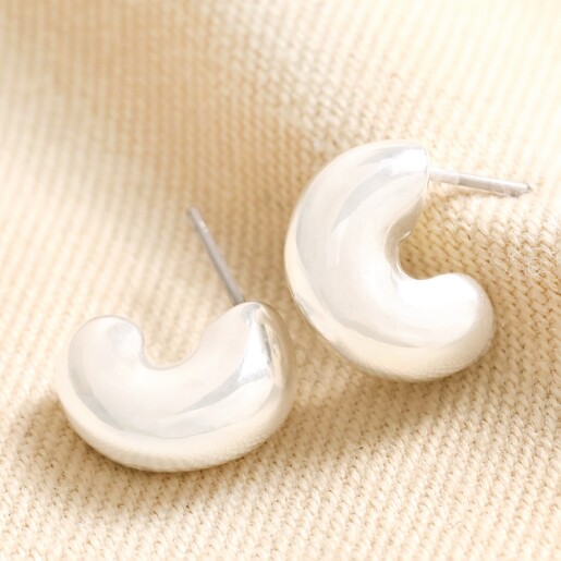 Small Chunky Half Hoop Earrings in Silver Small Chunky Half Hoop Earrings in Silver on Beige Fabric
