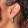 Close Up of Twist Hoop Earrings in Silver on Model