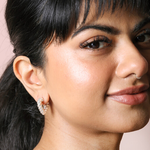 Twisted Rope Creole Heart Outline Hoop Earrings In Silver on ear