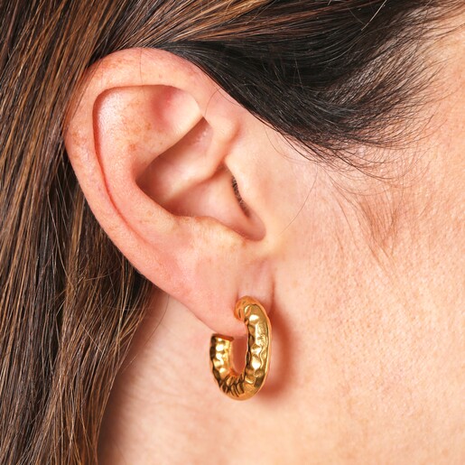 Close Up Model Shot Close Up Model Shot of Stainless Steel Molten Hammered Hoop Earrings in Gold