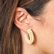 Close Up Model Shot of Beige Woven Hoop Earrings with Ball Backs