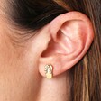 Close Up Model Shot of Cubic Zirconia Flip Flop Stud Earrings in Gold on Model