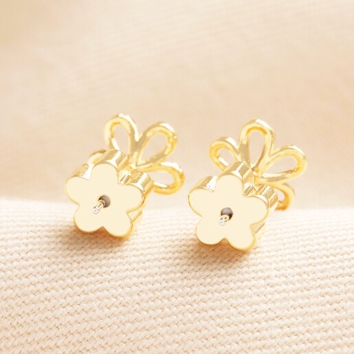 Delicate Outline Flower Stud Earrings in Gold with Flower Backs Delicate Outline Flower Stud Earrings in Gold with Flower Backs on a neutral background