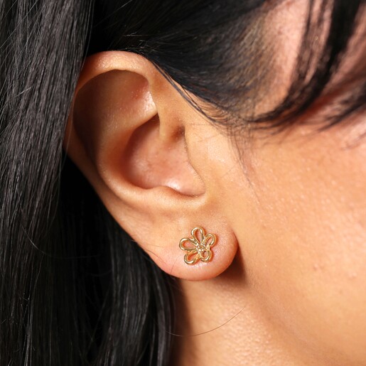 Close Up Model Shot Close Up Model Shot of Flower Outline Stud Earrings in Gold with Flower Backs