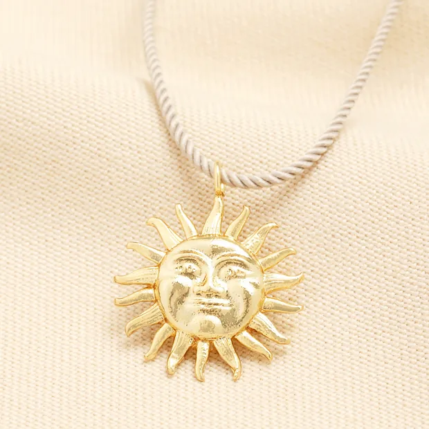 Beige Rope Pull Cord Sun Face Pendant Necklace in Gold Beige Rope Pull Cord Sun Face Pendant Necklace in Gold