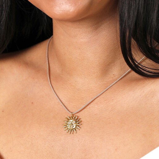 Beige Rope Pull Cord Sun Face Pendant Necklace in Gold on a model