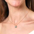 Blue Turtle Pendant Necklace in Gold on a model