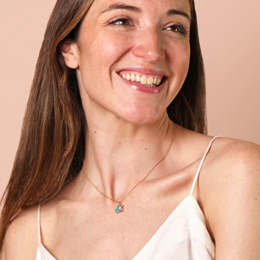 On a model Blue Turtle Pendant Necklace in Gold on a model
