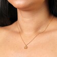 Delicate Flower Outline Pendant Necklace in Gold on model